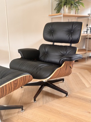 Eames lounge chair met Ottoman in palissander en echt zwart leer Repli